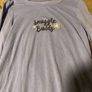 A pajama top that says “snuggle buddy”